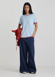 Model in Ricochet Haynes Admiral Blue jeans