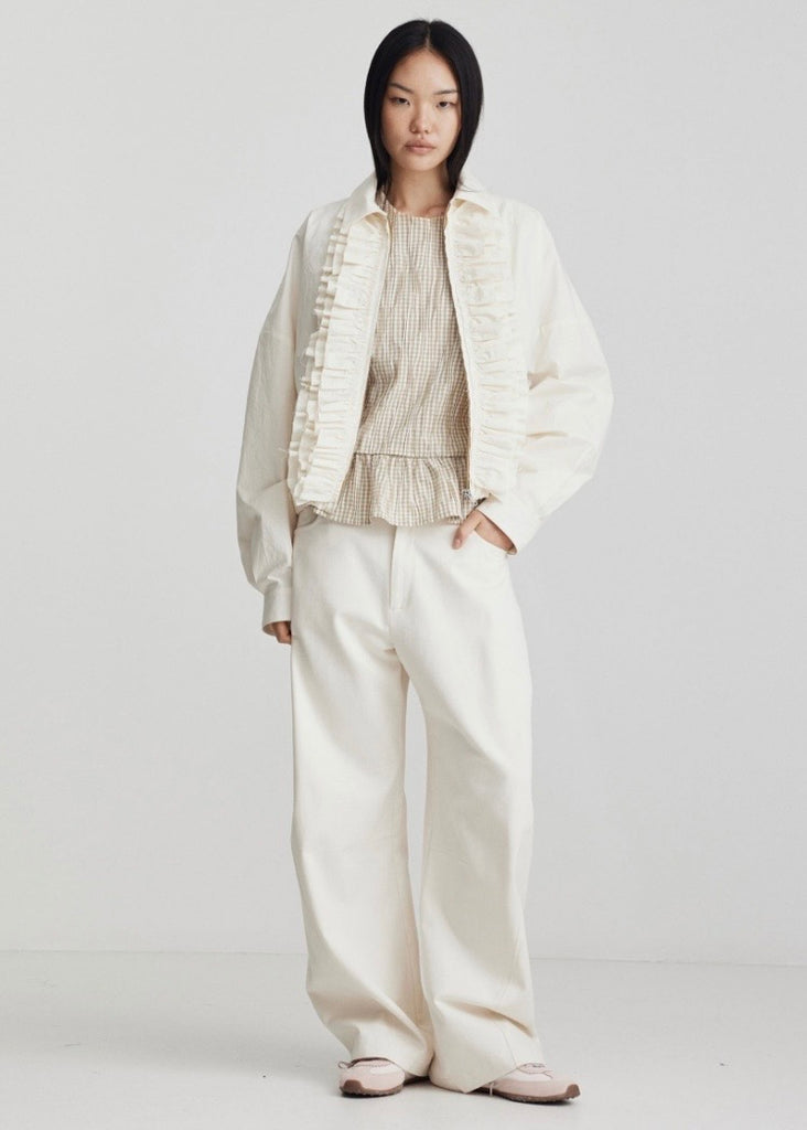 Model wearing Ricochet Nardi Ivory jean