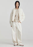 Model wearing Ricochet Nardi Ivory jean