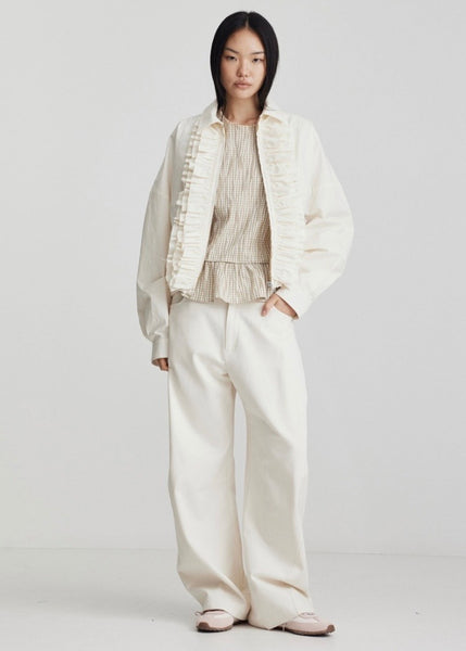 Model wearing Ricochet Nardi Ivory jean