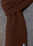 Close up view of Noble Wilde Moss Monti scarf in Rimu