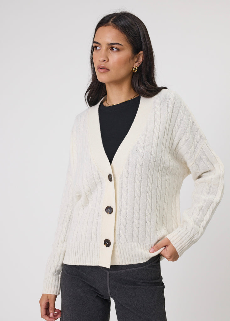 Model wearing Marlow Copenhagen Cable knit cardigan in ecru