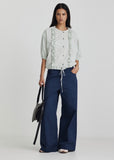 Model wearing Ricochet Haynes jean in Admiral Blue