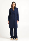 Model wearing Tuesday Twiggy coat in navy plaid 