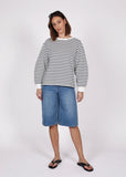 Model wearing Marlow Delta sweatshirt in white/ink stripe