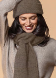 Model wearing Noble Wilde scarf in Latte