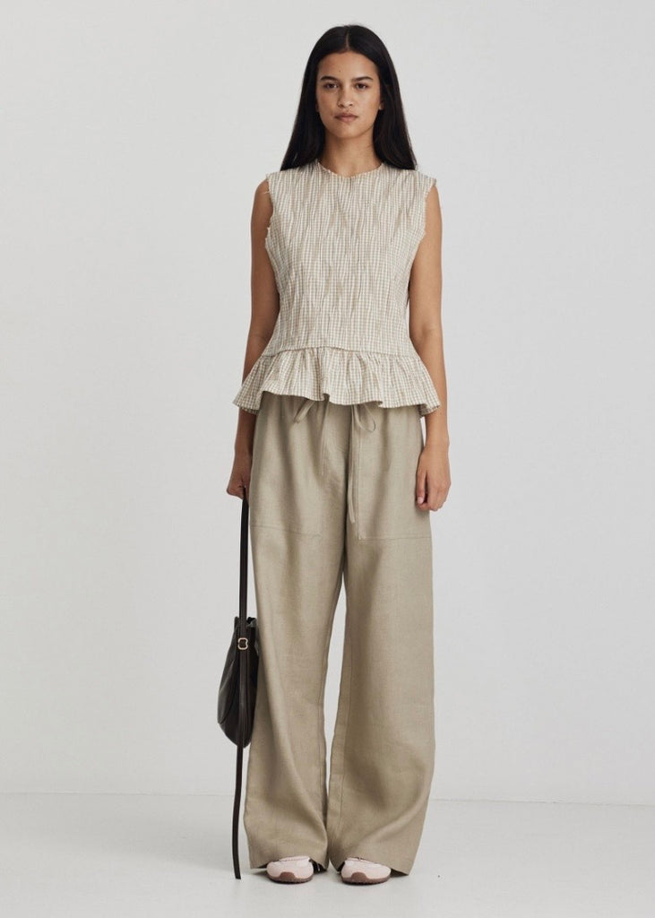 Model wearing Ricochet Marc pant in light taupe