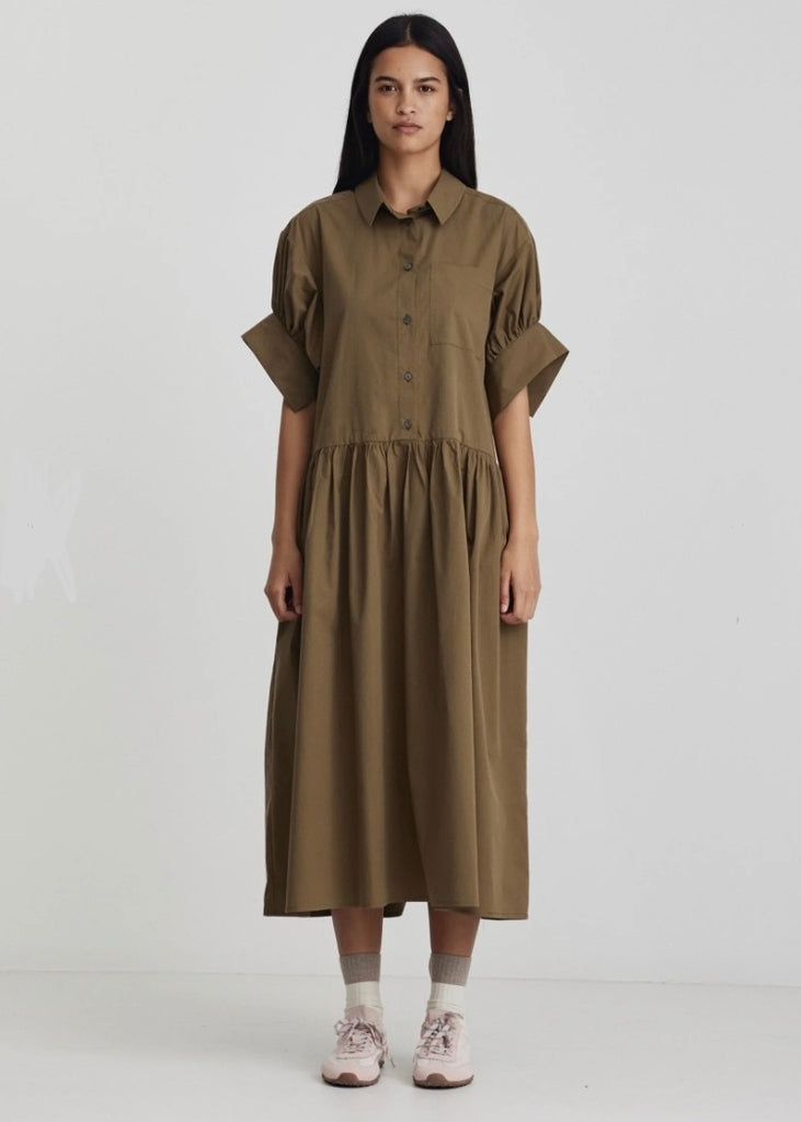 Model wearing Ricochet Joni Shirt Olive dress