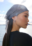 Model wearing Marlow prism print scarf in ink colour 