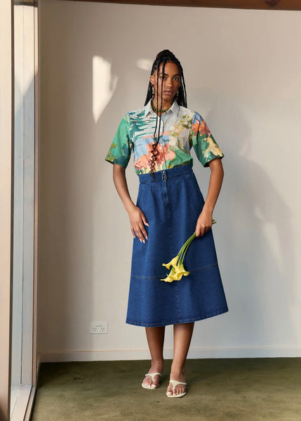 Model wearing Nancybird’s Aries skirt in Dark Wash 