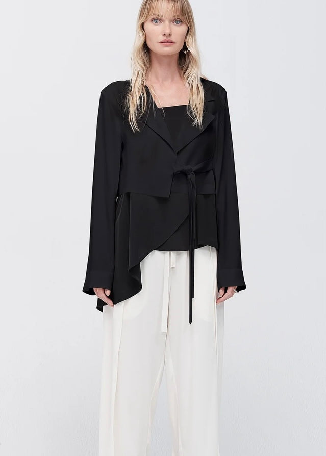 Model wearing Taylor Conduit black jacket
