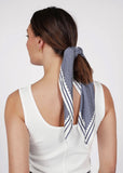Marlow prism print scarf tied in models hair 