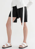Close up view of Taylor Relay black shorts